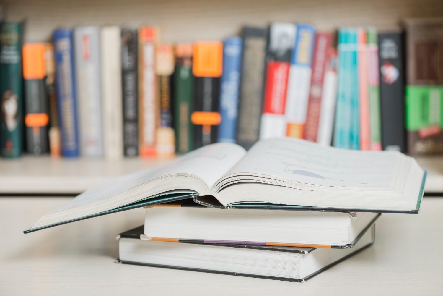 textbooks lying near bookcase (1)